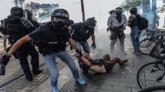 Anti-criminality brigade (BAC) police officers arrest a man during a gathering in Nantes on August 3, 2019 called in memory of Steve Maia CaniÁo whose body was found in the River Loire a month after he went missing during a police raid on a music festival. - Steve Maia Canico, 24, went missing on the night of June 21-22 after officers in the western city of Nantes moved in to disperse techno music fans attending a free concert as part of France's national music celebration day. More than a dozen concertgoers fell into the nearby River Loire during clashes with the police, prompting accusations of excessive force by officers trying to shut the party down. (Photo by JEAN-FRANCOIS MONIER / AFP)