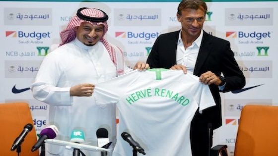 French football coach Herve Renard (R) and Saudi Football Federation chief Yasser Almisehal (L) pose with a Saudi national football team jersey bearing Renard's name, after signing him on as coach, in the Red Sea coastal city of Jeddah on August 5, 2019. - Renard, who resigned as Morocco coach following the team's surprise elimination at the African Cup of Nations, will take over Saudi Arabia's national team. "Happy to start a new adventure in Saudi Arabia on a new continent," the 50-year-old Frenchman had previously tweeted. He led Zambia to a surprise African Cup of Nations title in 2012 and has also coached the national teams of Angola, Ivory Coast and Morocco in Africa, as well as clubs in France, England, Algeria and Vietnam. (Photo by Amer HILABI / AFP)